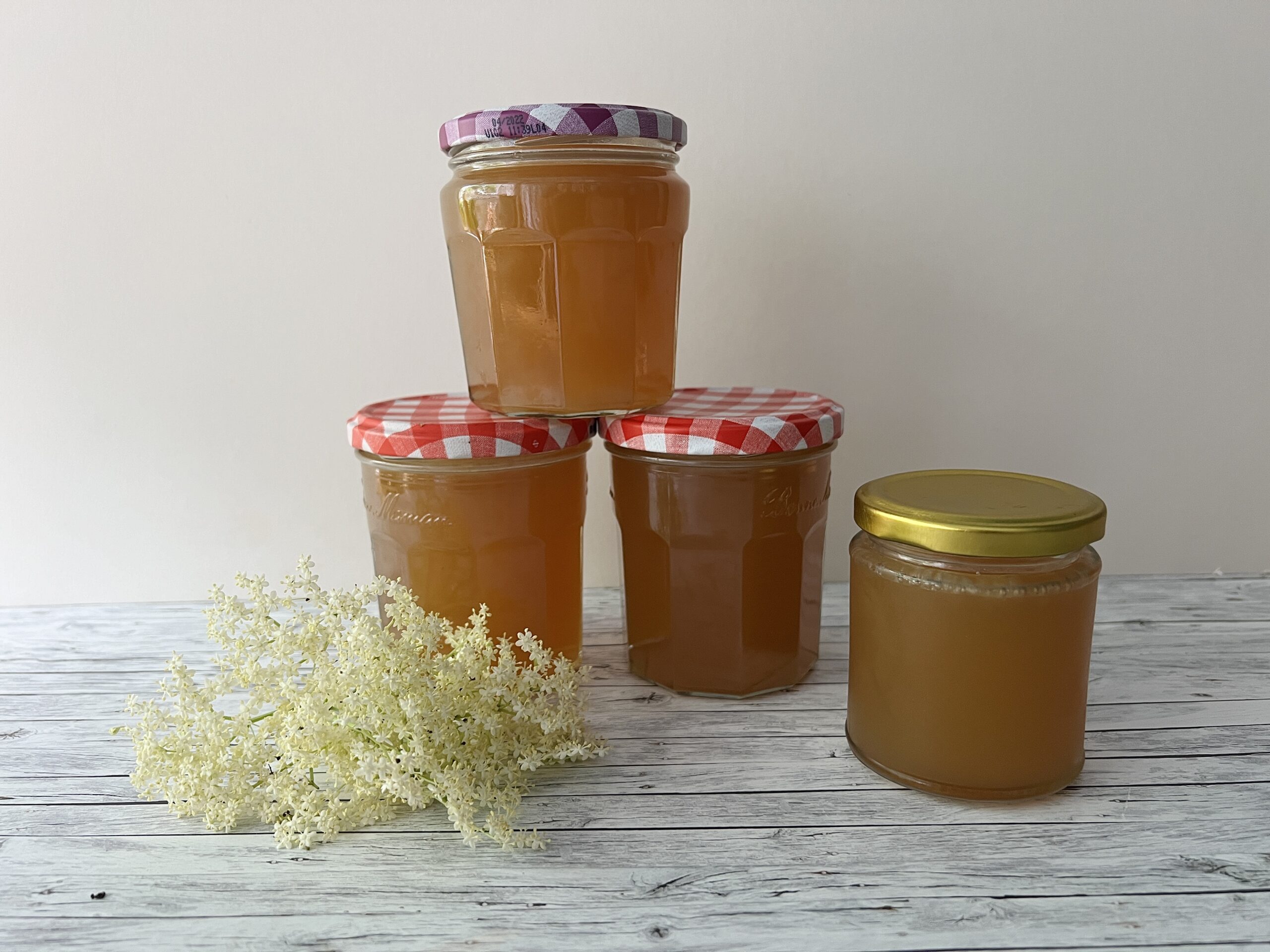 Four jars of apple and elderflower jelly