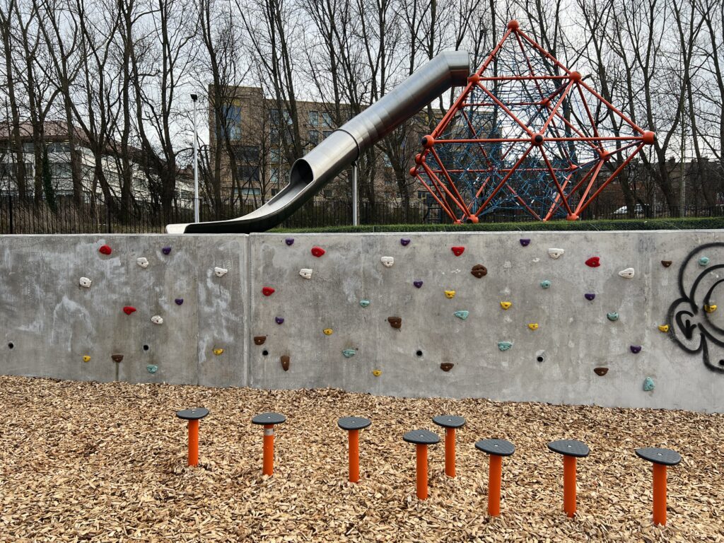 Dalry playground with climbing wall, balance beams, climbing frame and slide