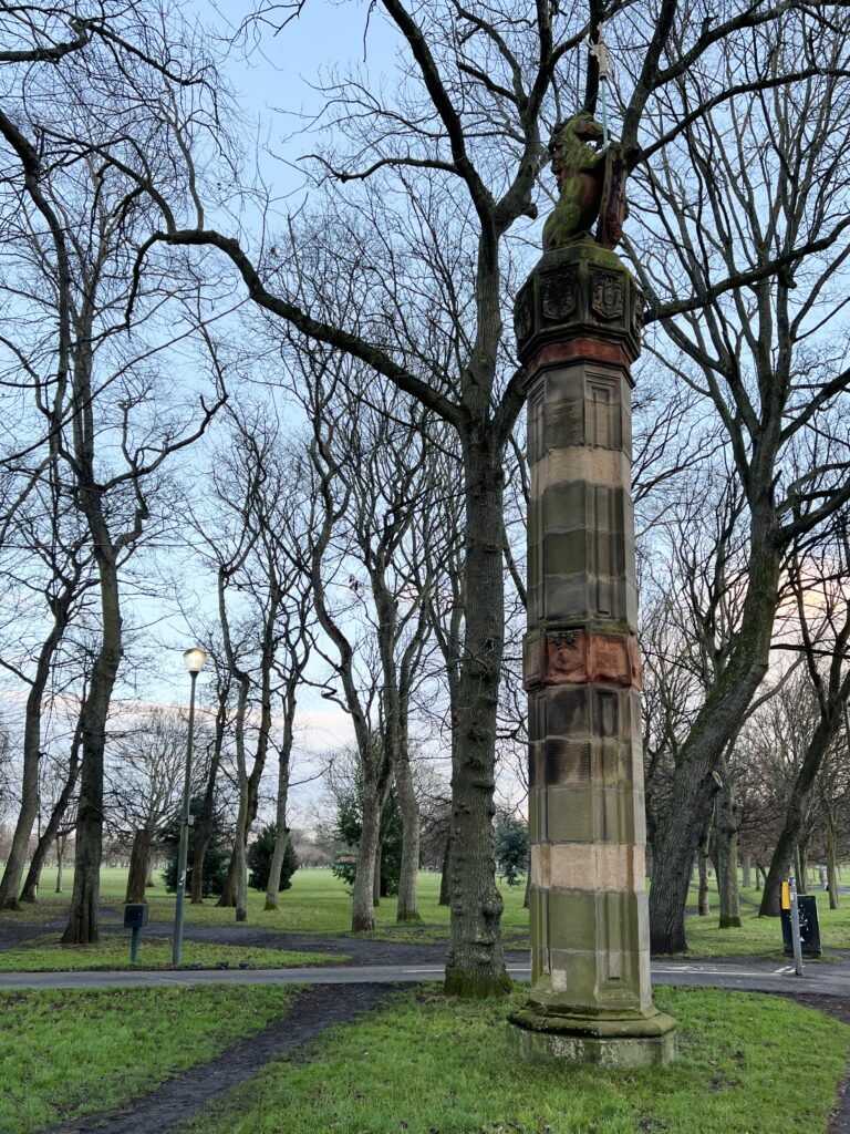 Pillar with a unicorn on top in The Meadows park in Edinburgh