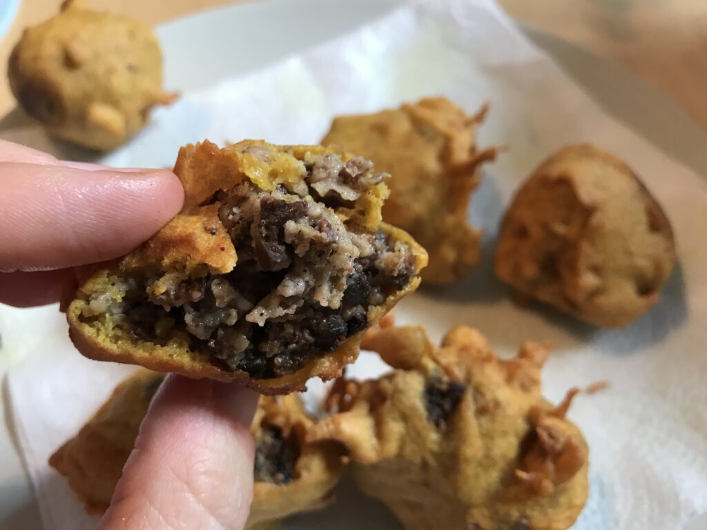 Hand holding up a Haggis pokora 